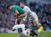 1 March 2015; Robbie Henshaw, Ireland, is tackled by George Kruis and George Ford, England. RBS Six Nations Rugby Championship, Ireland v England. Aviva Stadium, Lansdowne Road, Dublin. Picture credit: Matt Browne / SPORTSFILE