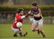 1 March 2015; Ben Brosnan, Wexford, in action against Patrick Reilly, Louth. Allianz Football League Division 3 Round 3, Louth v Wexford, County Grounds, Drogheda, Co. Louth. Picture credit: Tomás Greally / SPORTSFILE