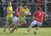 1 March 2015; Frank McGlynn, Donegal, in action against Tomas Clancy, Cork. Allianz Football League, Division 1, Round 3, Donegal v Cork. Fr Tierney Park, Ballyshannon, Co. Donegal. Picture credit: Oliver McVeigh / SPORTSFILE