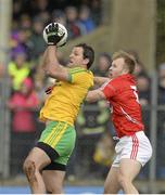 1 March 2015; Michael Murphy, Donegal, in action against  Michael Shields, Cork. Allianz Football League, Division 1, Round 3, Donegal v Cork. Fr Tierney Park, Ballyshannon, Co. Donegal. Picture credit: Oliver McVeigh / SPORTSFILE