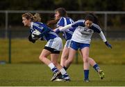 1 March 2015; Joyce Dunne, Laois, supported by team-mate Laura Peake, back, in action against Cathriona McConnell, Monaghan. TESCO HomeGrown Ladies National Football League Division 1 Round 4, Laois v Monaghan, Crettyard GAA club, Crettyard, Co. Laois. Picture credit: Pat Murphy / SPORTSFILE