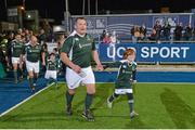 28 February 2015; Nick Popplewell, Ireland Legends, runs out for the start of the game with a team mascot. Ireland legends v England legends.  Donnybrook Stadium, Donnybrook, Dublin. Picture credit: Piaras Ó Mídheach / SPORTSFILE