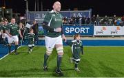 28 February 2015; Trevor Brennan, Ireland Legends, runs out for the start of the game with a team mascot. Ireland legends v England legends.  Donnybrook Stadium, Donnybrook, Dublin. Picture credit: Piaras Ó Mídheach / SPORTSFILE