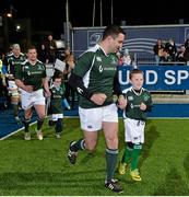 28 February 2015; Ireland Legends Jeremy Staunton runs out for the start of the game with a team mascot. Ireland legends v England legends.  Donnybrook Stadium, Donnybrook, Dublin. Picture credit: Piaras Ó Mídheach / SPORTSFILE