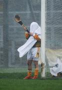 3 February 2008; Antrim goalkeeper Ryan McGarry dries his hurl during heavy rainfall. Walsh Cup Final, Antrim v Offaly, Casement Park, Belfast, Co. Antrim. Picture credit; Brian Lawless / SPORTSFILE
