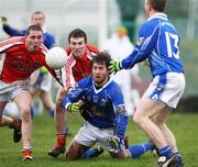 3 February 2008; Eddie O'Reilly, Cavan, in action against Gareth O'Neill and Brendan Donaghy, Armagh. Allianz National Football League, Division 2, Round 1, Armagh v Cavan, St Oliver Plunkett Park, Crossmaglen, Co Armagh. Picture credit: Oliver McVeigh / SPORTSFILE