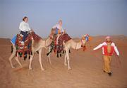 28 January 2008; Cork footballers Rena Buckley, left, and Nollaig Cleary try out some camel rides during a Safari Trip. O'Neills/TG4 Ladies Gaelic Football All Star Tour 2007, Dubai, United Arab Emirates. Picture credit: Brendan Moran / SPORTSFILE  *** Local Caption ***