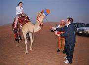 28 January 2008; Tyrone footballer Cathy Donnelly and RTE's Marty Morrissey try out some camel rides during a Safari Trip. O'Neills/TG4 Ladies Gaelic Football All Star Tour 2007, Dubai, United Arab Emirates. Picture credit: Brendan Moran / SPORTSFILE  *** Local Caption ***