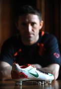 4 February 2008; Republic of Ireland captain Robbie Keane pictured with a pair of specially commissioned Republic of Ireland coloured Nike Total 90 Laser football boots which he will wear against Brazil on Wednesday the 6 February 2008. Portmarnock, Dublin. Picture credit: David Maher / SPORTSFILE