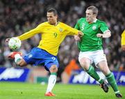 6 February 2008; Luis Fabiano, Brazil, in action against Richard Dunne, Republic of Ireland. International Friendly, Republic of Ireland v Brazil, Croke Park, Dublin. Picture credit; Pat Murphy / SPORTSFILE