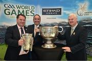 5 March 2015; Uachtarán Chumann Lúthchleas Aogán Ó Feargháil with James Kennedy, Ballinabrakey, and Paddy  Darcy, Dunderry, Co Meath, and the Liam MacCarthy and the Sam Maguire cups at the GAA World Games - Business Forum, Park Rotana Hotel, Abu Dhabi, United Arab Emirates. Picture credit: Ray McManus / SPORTSFILE