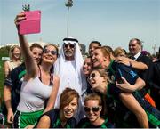 6 March 2015; Dearbhla McGeoghegan, 'Big D' as she is known to friends, and her Abu Dhabi team mates pose for a selfie with H.E. Sheikh Nahayan Mabarak Al Nahayan, Minister of Culture, Youth and Community Development, at the opening of the games. Zayed Sports Stadium, Abu Dhabi, United Arab Emirates. Picture credit: Ray McManus / SPORTSFILE