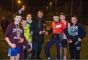 6 March 2015; Republic of Ireland assistant manager Roy Keane presents the Late Night Leagues finals trophy to Knocknaheeny team captain Adam Crowley. Late Night Leagues is a youth diversion programme, run in conjunction with the Gardaí, Foróige and the FAI, and sponsored by IPB, to utilise football as a tool for social inclusion.  Sam Allen Pitches, Leisure World, Churchfield, Cork City. Picture credit: Matt Browne / SPORTSFILE