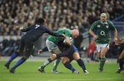 9 February 2008; Bernard Jackman, Ireland, is tackled by Fulgence Ouedraogo, left, and Julien Brugnaut, France. RBS Six Nations Rugby Championship, France v Ireland, Stade De France, Paris, France. Picture credit; Brendan Moran / SPORTSFILE *** Local Caption ***