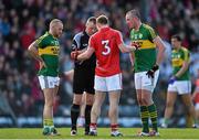 8 March 2015; Referee Anthony Nolan speaks to Barry John Keane, left, and Kieran Donaghy, Kerry, and Eoin Cadogan, Cork, before issueing yellow cards to all 3 players. Allianz Football League, Division 1, Round 4, Cork v Kerry, Páirc Uí Rinn, Cork. Picture credit: Brendan Moran / SPORTSFILE