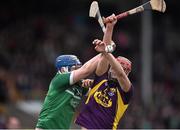 8 March 2015; Paul Morris, Wexford, in action against Richie McCarthy, Limerick. Allianz Hurling League, Division 1A, Round 3, Wexford v Limerick, Wexford Park, Wexford. Picture credit: David Maher / SPORTSFILE