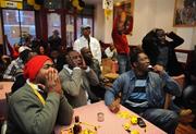 10 February 2008; Members of Dublin's African Community with react to a missed chance by Cameroon while watching the African Cup of Nations Final between Cameroon and Egypt, on the big screen in the 'Decency African Cuisine'. This special screening was sponsored by the Western Union. African Cup of Nations Final, 'Decency African Cuisine', Mountjoy Street, Dublin. Photo by Sportsfile