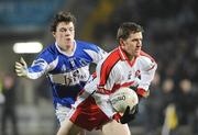 16 February 2008; Enda Muldoon, Derry, in action against John O'Loughlin, Laois. Allianz National Football League, Division 1, Round 2, Laois v Derry, O'Moore Park, Portlaoise, Co. Laois. Picture credit; Pat Murphy / SPORTSFILE *** Local Caption ***