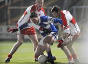 16 February 2008; Brendan Quigley, Laois, in action against Barry McGoldrick, left, and Francis McEldowney, Derry. Allianz National Football League, Division 1, Round 2, Laois v Derry, O'Moore Park, Portlaoise, Co. Laois. Picture credit; Pat Murphy / SPORTSFILE *** Local Caption ***