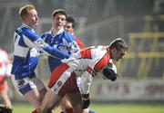 16 February 2008; James Conway, Derry, in action against Padraig Clancy, left, and Brendan Quigley, Laois. Allianz National Football League, Division 1, Round 2, Laois v Derry, O'Moore Park, Portlaoise, Co. Laois. Picture credit; Pat Murphy / SPORTSFILE