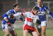 16 February 2008; Conleith Gilligan, Derry, in action against Cathal Ryan, Laois. Allianz National Football League, Division 1, Round 2, Laois v Derry, O'Moore Park, Portlaoise, Co. Laois. Picture credit; Pat Murphy / SPORTSFILE *** Local Caption ***