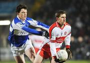 16 February 2008; Enda Muldoon, Derry, in action against John O'Loughlin, Laois. Allianz National Football League, Division 1, Round 2, Laois v Derry, O'Moore Park, Portlaoise, Co. Laois. Picture credit; Pat Murphy / SPORTSFILE *** Local Caption ***