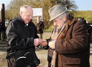 17 February 2008; Sean Moloney, right, from O'Callaghans Mills, Co. Clare, purchases his admittance ticket from Jimmy McNamara, Ennis, outside the gates. Allianz National Hurling League, Division 1B, Round 2, Clare v Laois, Scarriff GAA Park, Scarriff, Co. Clare. Picture credit; Ray McManus / SPORTSFILE *** Local Caption ***
