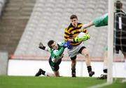 17 February 2008; Con Dunne, Canovee, is tackled by Ryan Crilly, Rock, as he bears down on goal. All-Ireland Junior Club Football Championship Final, Canovee, Cork v Rock, Tyrone, Croke Park, Dublin. Picture credit; Stephen McCarthy / SPORTSFILE *** Local Caption *** Corkman
