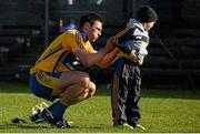 8 March 2015; Conor Ryan, Clare, signs an autograph for Dylan Killeen, aged 6, from Inch, Co. Clare, after defeat to Tipperary. Allianz Hurling League, Division 1A, Round 3, Clare v Tipperary. Cusack Park, Ennis, Co. Clare. Picture credit: Diarmuid Greene / SPORTSFILE