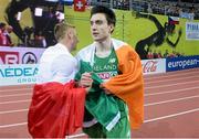 8 March 2015; Ireland's Mark English with race winner Marcin Lewandowski, Poland, left, after his Men's 800m Final event, where he finished in second position with a time of 1:47.20. European Indoor Athletics Championships 2015, Day 4, Prague, Czech Republic. Picture credit: Pat Murphy / SPORTSFILE