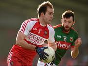 8 March 2015; Brian Og McAlary, Derry, in action against Kevin McLoughlin, Mayo. Allianz Football League, Division 1, Round 4, Derry v Mayo, Celtic Park, Derry. Photo by Sportsfile