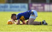 8 March 2015; Padraic Maher, Tipperary, goes down holding his head after receiving a knock. Allianz Hurling League, Division 1A, Round 3, Clare v Tipperary. Cusack Park, Ennis, Co. Clare. Picture credit: Diarmuid Greene / SPORTSFILE