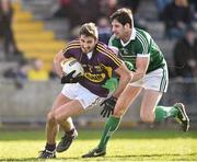 8 March 2015; Brian Malone, Wexford, in action against Padraig Browne, Limerick. Allianz Football League, Division 3, Round 4, Wexford v Limerick, Wexford Park, Wexford Picture credit: David Maher / SPORTSFILE
