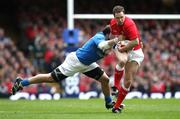 23 February 2008; Mark Jones, Wales, is tackled by Martin Castrogiovanni, Italy. RBS Six Nations Rugby Championship, Wales v Italy,  Millennium Stadium, Cardiff, Wales. Picture credit; Steve Pope / SPORTSFILE *** Local Caption ***