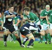 23 February 2008; Ireland's Brian O'Driscoll is tackled by Scotland's Ross Rennie, right, and Ali Hogg. RBS Six Nations Rugby Championship, Ireland v Scotland, Croke Park, Dublin. Picture credit; Brendan Moran / SPORTSFILE