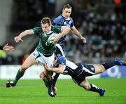 23 February 2008; Ireland's Tommy Bowe is tackled by Scotland's Nick De Luca. RBS Six Nations Rugby Championship, Ireland v Scotland, Croke Park, Dublin. Picture credit; Pat Murphy / SPORTSFILE