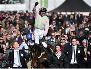 10 March 2015; Ruby Walsh on Douvan celebrates in the parade ring after winning the Supreme Novices' Hurdle. Cheltenham Racing Festival 2015, Prestbury Park, Cheltenham, England. Picture credit: Ramsey Cardy / SPORTSFILE