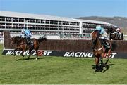 10 March 2015; Un De Sceaux, right, with Ruby Walsh up, leads God's Own, with Paddy Brennan up, who finished second, on their way to winning the Arkle Challenge Trophy, after clearing the last. Cheltenham Racing Festival 2015, Prestbury Park, Cheltenham, England. Picture credit: Ramsey Cardy / SPORTSFILE