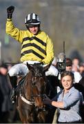 10 March 2015; Jockey Paul Townend celebrates as he's led into the winner's enclosure after victory in the David Nicholson Mares' Hurdle on Glens Melody. Cheltenham Racing Festival 2015, Prestbury Park, Cheltenham, England. Picture credit: Ramsey Cardy / SPORTSFILE