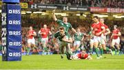 21 March 2009; Tommy Bowe, Ireland, goes over for the second try of the game despite the attention of Shane Williams, Wales. RBS Six Nations Championship, Wales v Ireland, Millennium Stadium, Cardiff, Wales. Picture credit: Matt Browne / SPORTSFILE