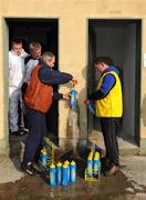 17 February 2008; Laois 'kitman' and former intercounty referee Pat Delaney, 2nd from right, and Shane Corby, right, wash and fill bottles with water under the watchful eyes of umpire Paul Mitchell and linesman Pat Graham. Allianz National Hurling League, Division 1B, Round 2, Clare v Laois, Scarriff, Co. Clare. Picture credit; Ray McManus / SPORTSFILE
