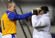 8 February 2008; Longford goalkeeper Damien Sheridan helps an umpire with his hat after it was knocked off by a ball. O'Byrne Cup Final, Dublin v Longford, Parnell Park, Dublin. Picture credit; Brian Lawless / SPORTSFILE