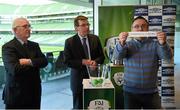 13 March 2015; Terry Cassin, Umbro, pulls out the names of St. Mochtas F.C. and UCC AFC, while being watched on by Jim McConnell, left, chairman of the FAI Domestic Committee Gerry McDermott, FAI Communications Manager, during the FAI Umbro Intermediate Cup Semi-Final Draw. Aviva Stadium, Lansdowne Road, Dublin. Photo by Sportsfile