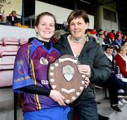 24 February 2008; University of Limerick captain Siobhan Murphy receives the Ashbourne Shield from Neasa O'Donnell, President CCAO, 3rd Level Colleges Camogie. 2008 Ashbourne Shield Final, University of Limerick v University College Cork, Casement Park, Belfast, Co. Antrim. Picture credit: Oliver McVeigh / SPORTSFILE