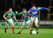 1 March 2008; Colm Parkinson, Laois, in action against Billy Joe Padden, Mayo, as team-mate Peadar Gardiner looks on. Allianz National Football League, Division 1, Round 3, Laois v Mayo, O'Moore Park, Portlaoise. Photo by Sportsfile