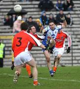 2 March 2008; Paul Finlay, Monaghan, slots over a point despite the challenge of Enda McNulty, Monaghan. Allianz National Football League, Division 2, Round 3, Monaghan v Armagh, St Tighearnach's Park, Clones, Co. Monaghan. Picture credit: Oliver McVeigh / SPORTSFILE