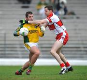 2 March 2008; Kerry goalkeeper Kieran Cremin is tackled by Enda Muldoon, Derry. Allianz National Football League, Division 1, Round 3, Kerry v Derry, Fitzgerald Stadium, Killarney, Co. Kerry. Picture credit: Brendan Moran / SPORTSFILE