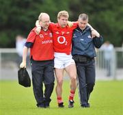 2 March 2008; Cork's Anthony Lynch leaves the pitch with help from medical staff during the first half. Allianz National Football League, Division 2, Round 3, Roscommon v Cork, Kiltoom, Roscommon. Picture credit: David Maher / SPORTSFILE