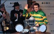 13 March 2015; Jockey Tony McCoy before presenting the trophy to Tom Scudamore for winning the Grand Annual Chase. Cheltenham Racing Festival 2015, Prestbury Park, Cheltenham, England. Picture credit: Ramsey Cardy / SPORTSFILE