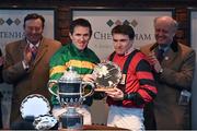 13 March 2015; Jockey Tony McCoy presents the winning trophy to Tom Scudamore for winning the Grand Annual Chase. Cheltenham Racing Festival 2015, Prestbury Park, Cheltenham, England. Picture credit: Ramsey Cardy / SPORTSFILE